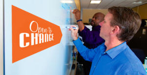 Mike Eke writes a flow chart diagram on a white board