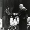 C. A. Roberson congratulates students at commencement. Click for details