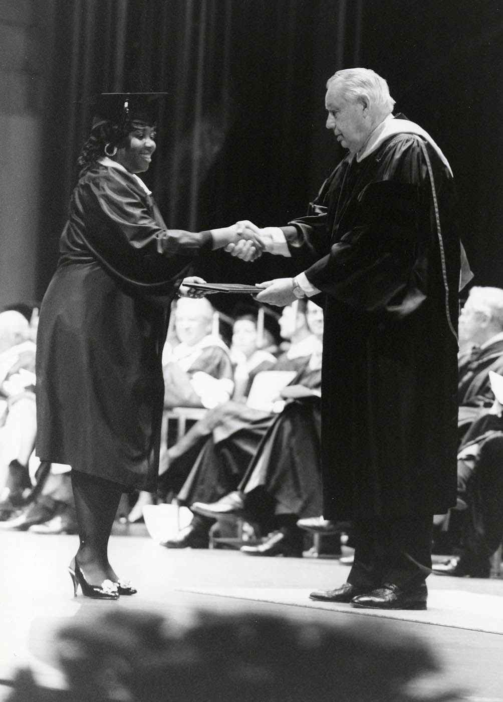 C.A. Roberson congratulates a graduate