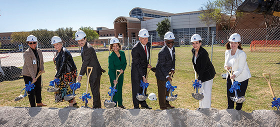TCC administrative team holding shovels at Southeast Campus construction groundpbreaking.