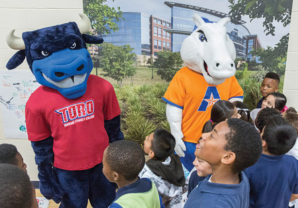 TCC's Toro and UTA's Blaze talk to elementary school students