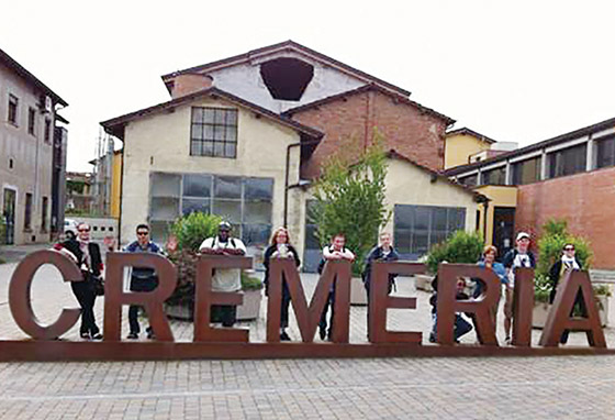 An old-fashioned building with a large sign reading Cremeria