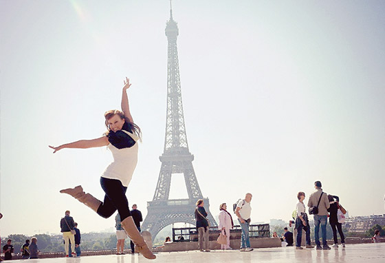 Eiffel Tower with a dancer leaping in front of it