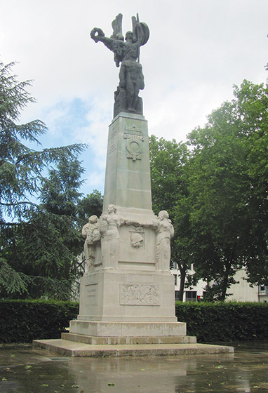 A angelic statue, wings spread, atop a marble plinth