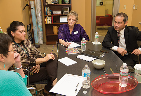 More people sitting at a conference table