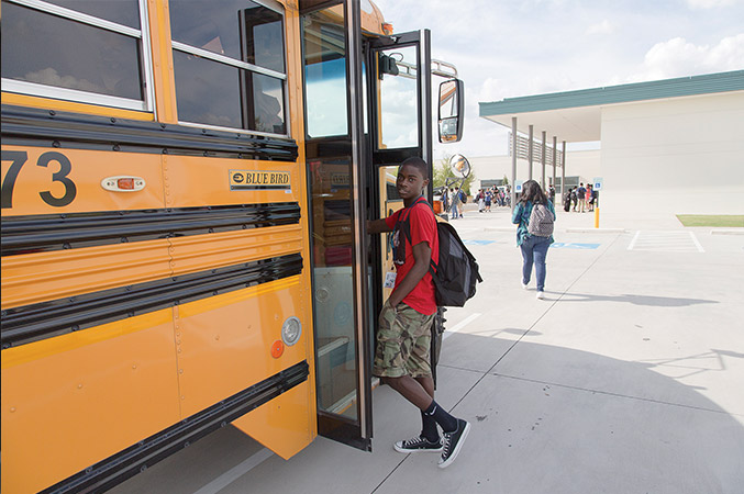 Juarel boards the school bus