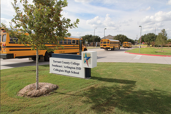 A school bus parked in front of the Early College High School building