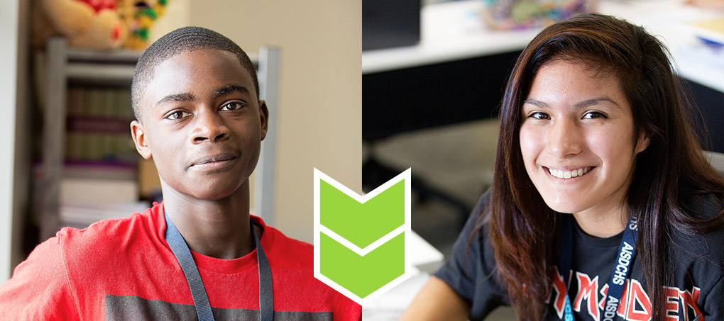 Two young teen students, male and female, smile for the camera