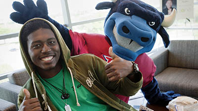 A student and Toro ham it up for the camera