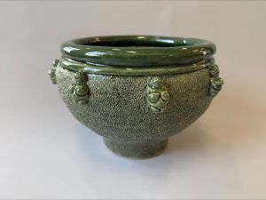 A green bowl made of glazed stoneware