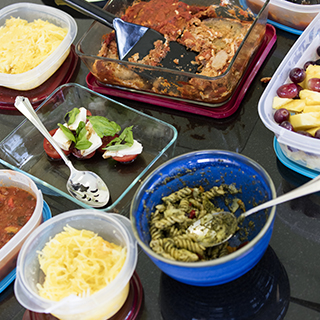 Food in containers laid out on a table