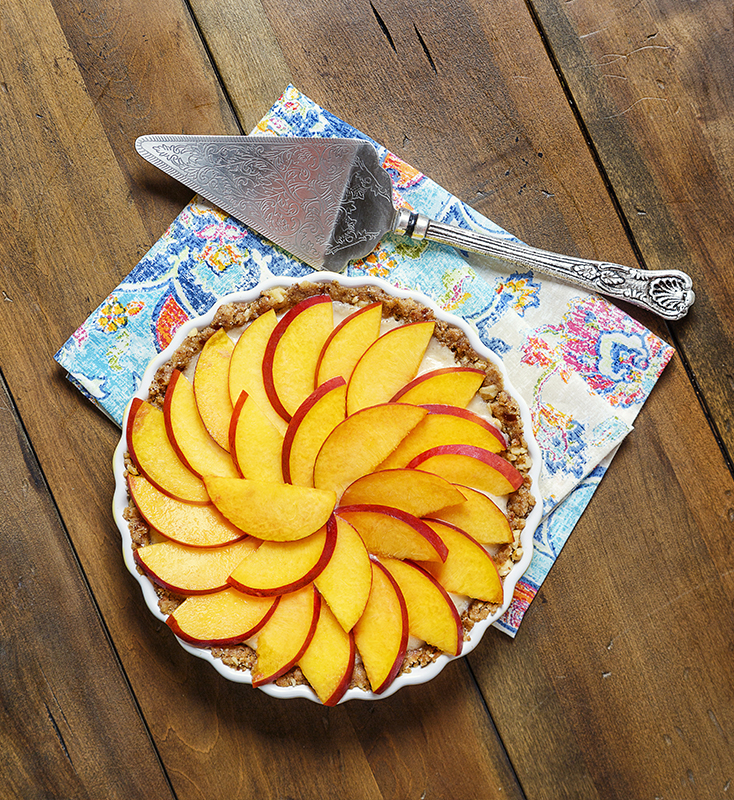 a raw peach tart ready to serve