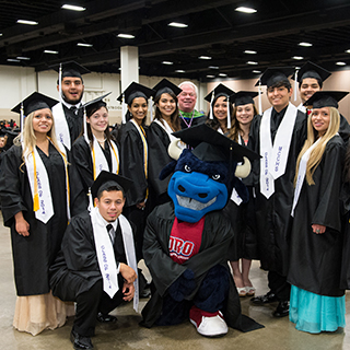 Graduating students posing with Toro