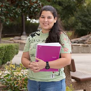 Abigail Ransaw holding school books