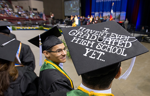 Picture of a student's graduation cap that reads, "I haven't even graduated high school yet..."