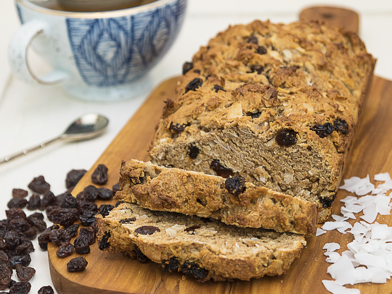 Loaf of Barbados Coconut Sweet Bread with a few slices cut