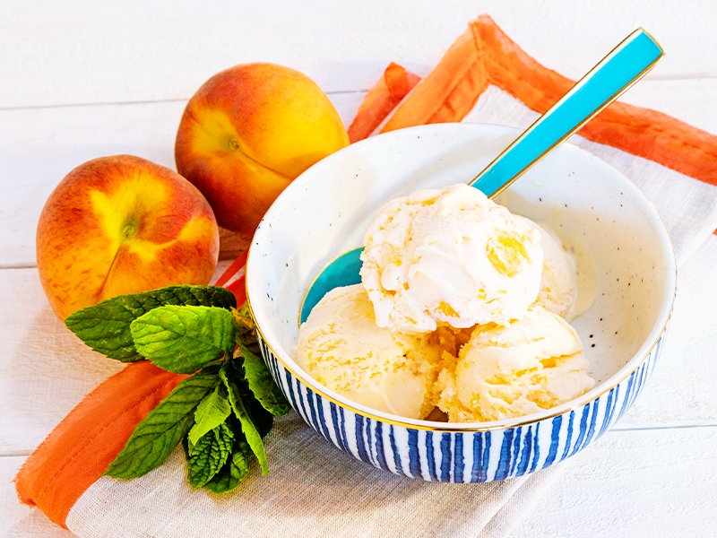 Peach ice cream in a bowl