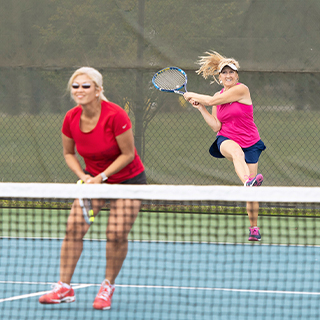 Two women playing tennis