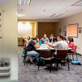 Students studying at a large table