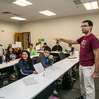 SI instructor standing at the front of a classroom