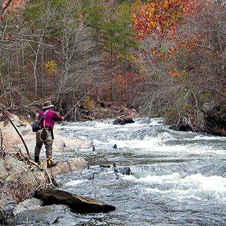 Dale fishing on a river