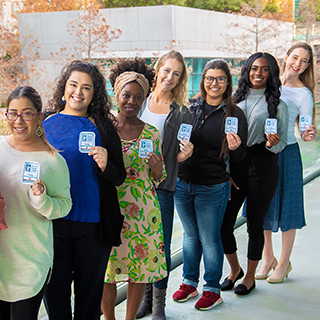 Nursing students with their nursing IDs