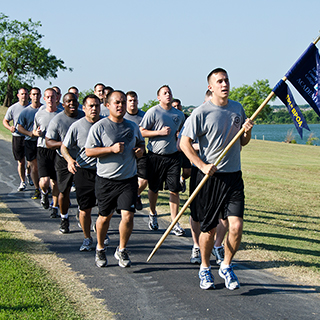 Firefighter studenst training during a run