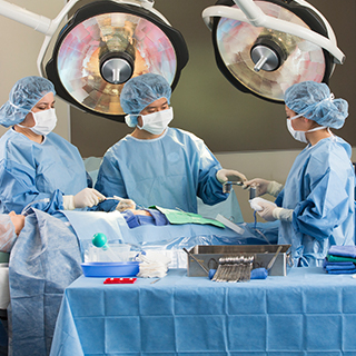 Nursing students practicing on a dummy patient