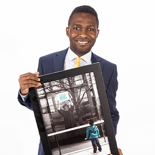 Ajonah holding the Dream Big framed picture