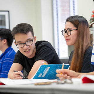 Two students sitting at a desk