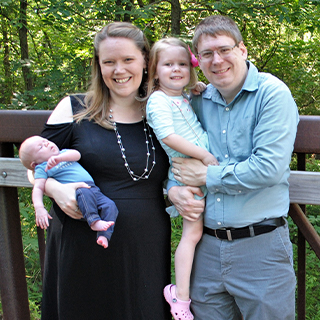 Couple posing with two kids