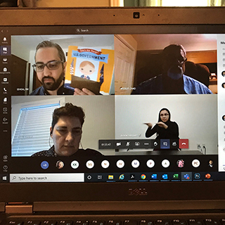 A virtual meeting of 4 people on screen