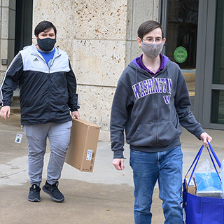 TCC employees bringing computers out to employee cars