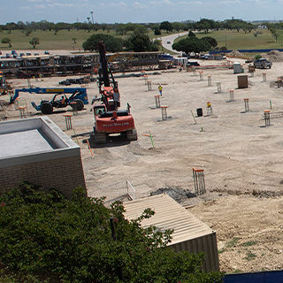 Wide view of the cleared construction site with machinery
