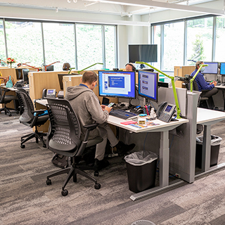 Man sitting at desk in open office concept design