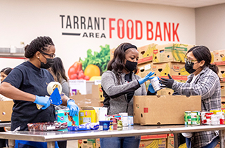 students loading food in boxes