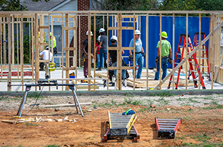 workers framing a house