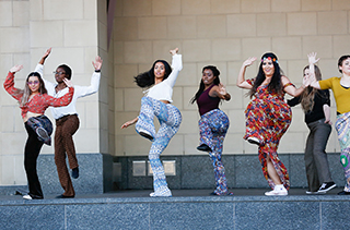 group of dancers on stage