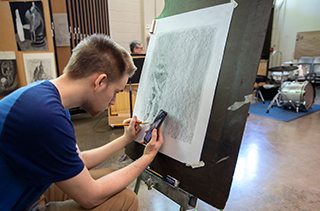 male student drawing 