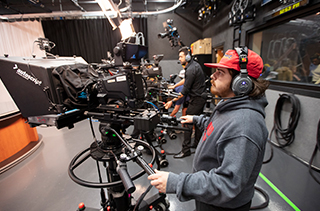 students using video cameras in studio