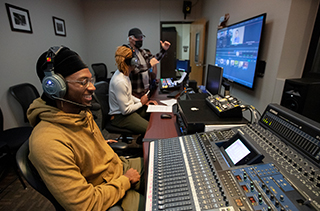 students working in the control room