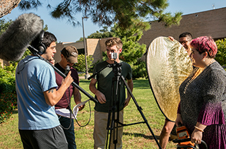 group of RTVF students working outside