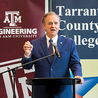 Texas A&M representative talking at microphone