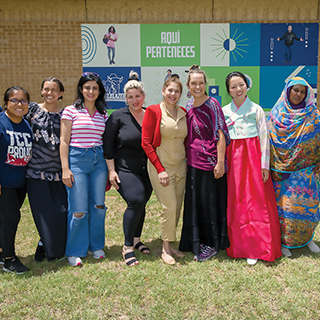 Group of international students standing outside a Northeast Campus Building