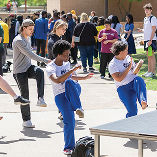 A group of students perfoming a dance routine.