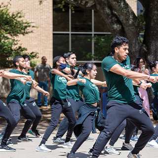 A group of students performing a dance routine.