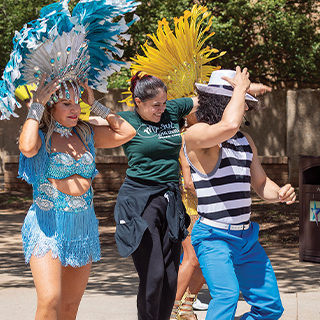 Students trying to follow dance instructions from Carnival dance instructors.