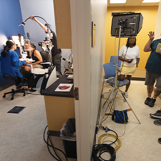 At a second location, the production crew sets up a new scene.