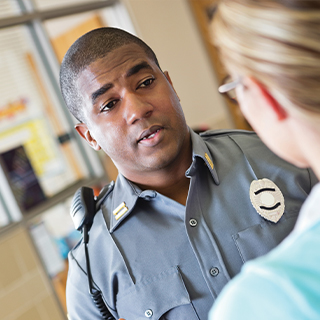 Security guard talking with a woman